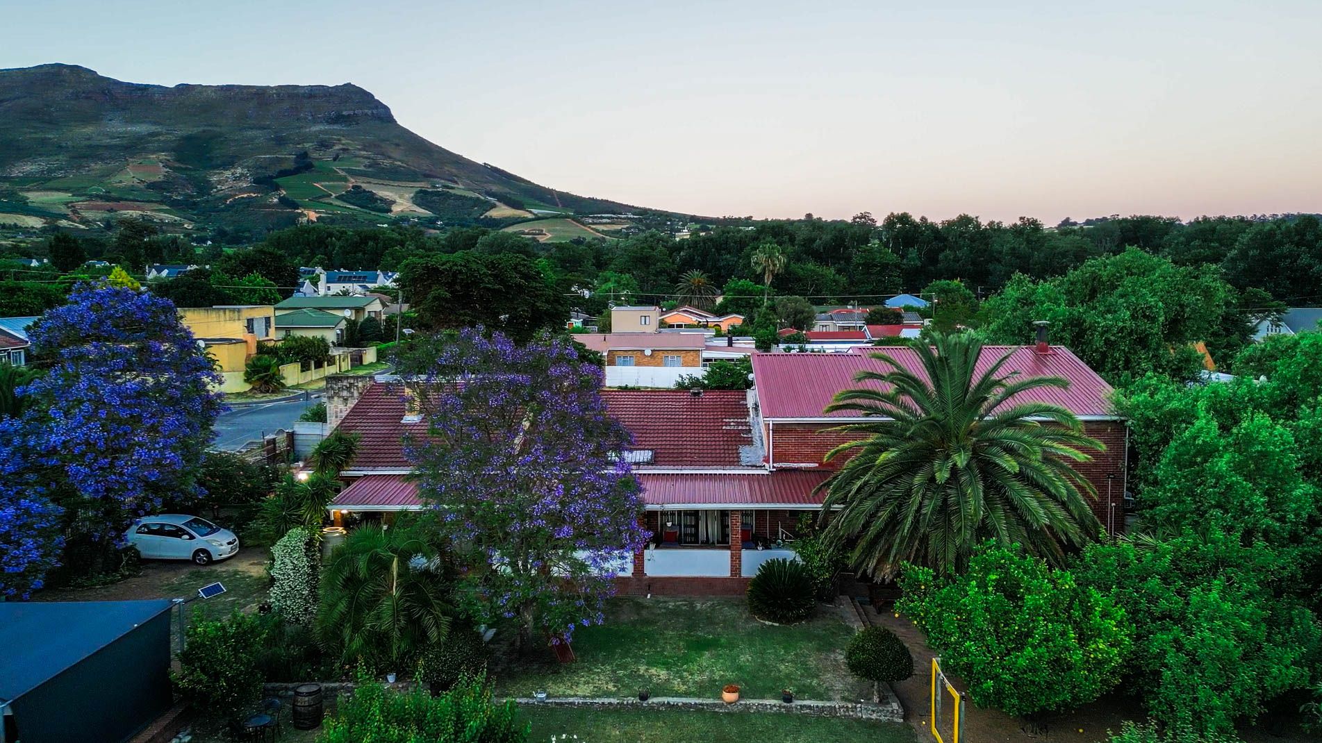 Aerial view of Staymore with mountain backdrop at dusk