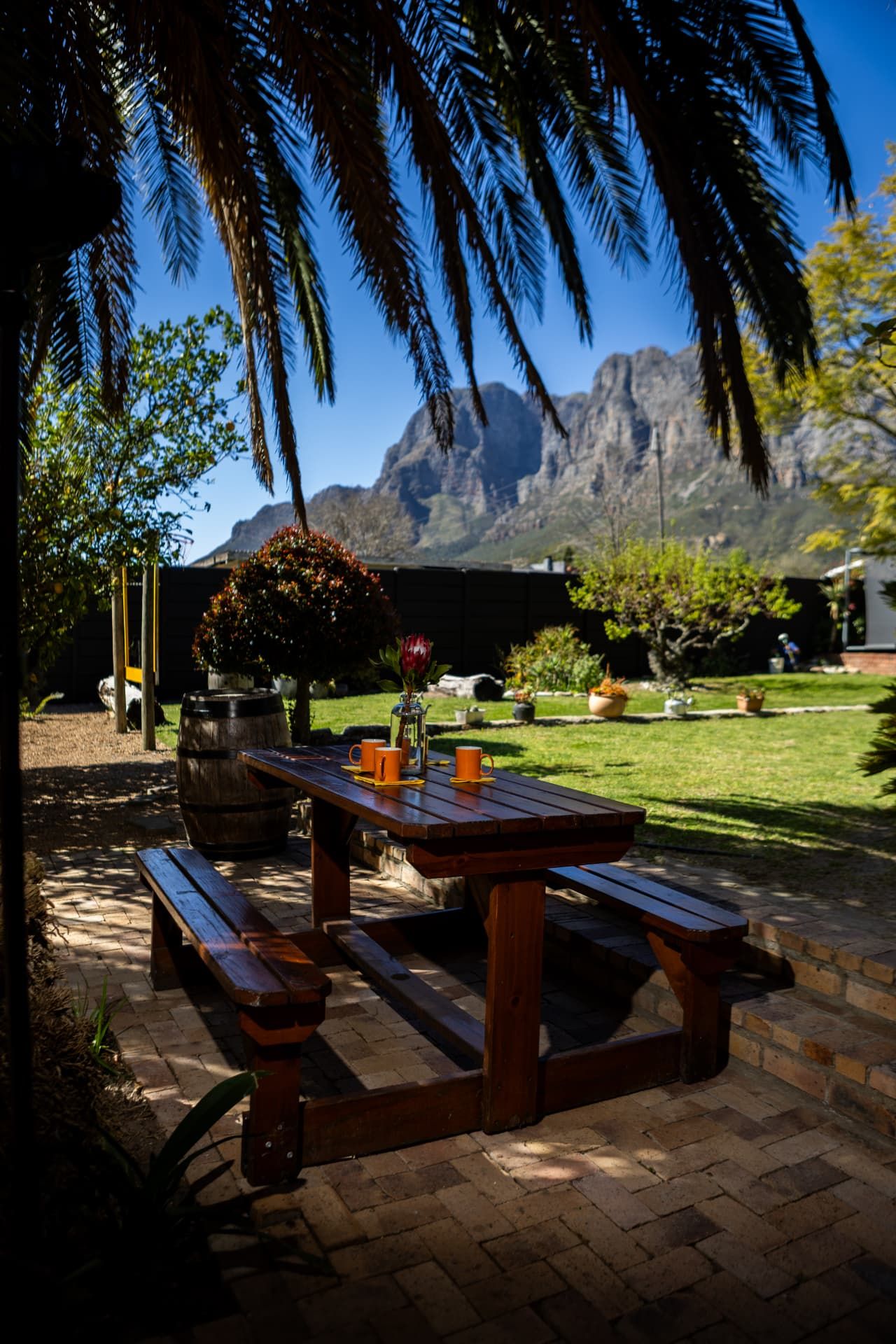 Garden breakfast table at Staymore with the mountains beyond