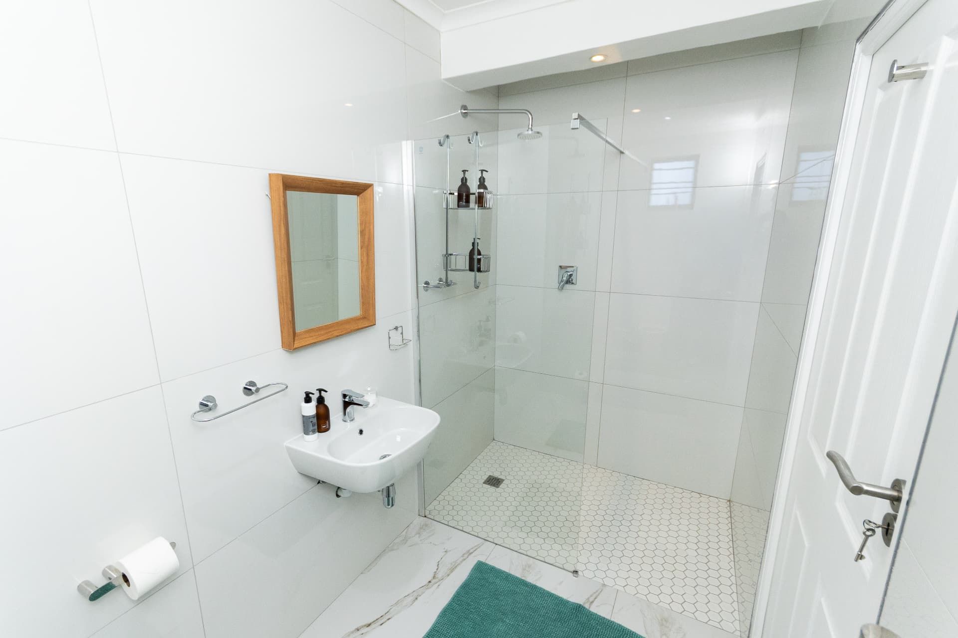 Bright en-suite bathroom with walk-in shower